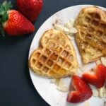 Overehead shoot of a white plate with 2 french toast waffles