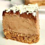 A slice of chocolate cheesecake on a white plate