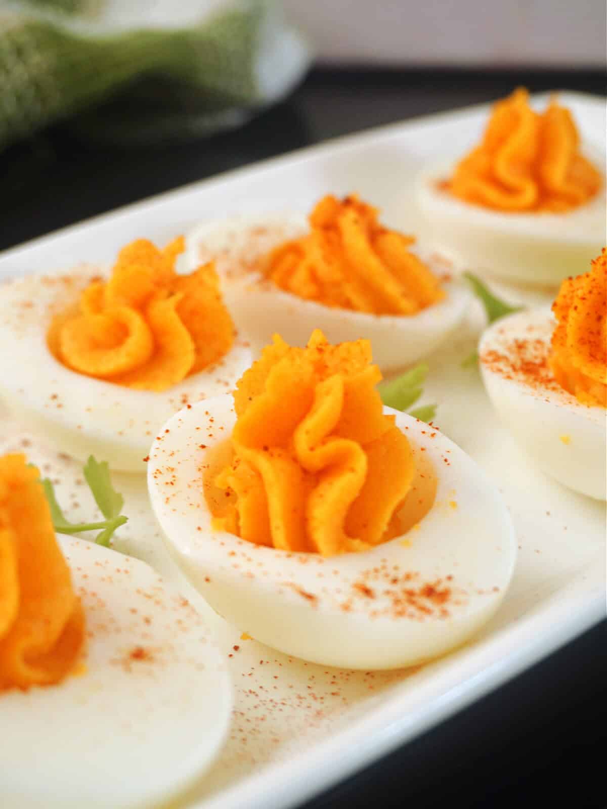 A white plate with 6 deviled eggs