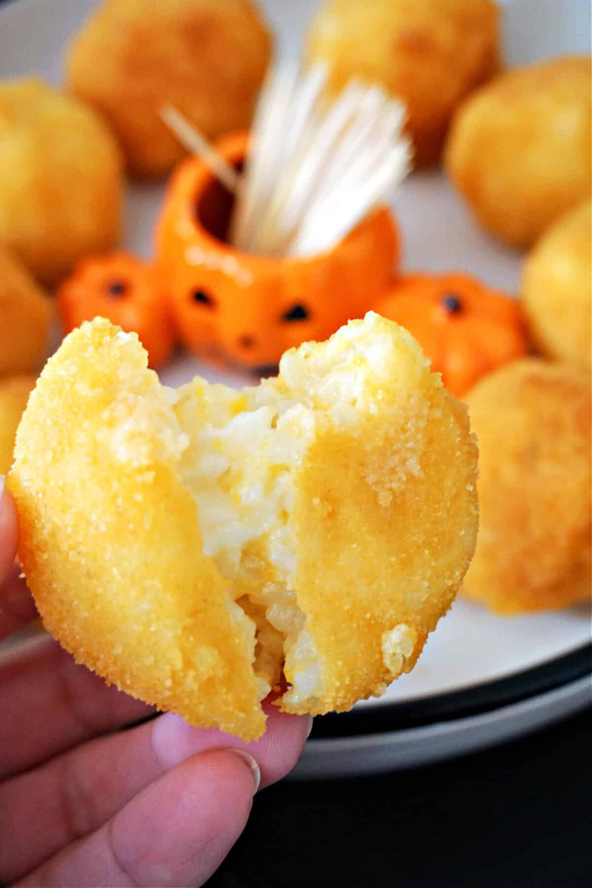 An arancini cut into half to see how it looks inside.