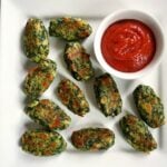 Healthy baked Brussels sprout cheese spinach bites served with ketchup, a delightful finger food for any age