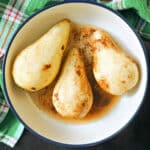 3 peeled pears in a bowl.