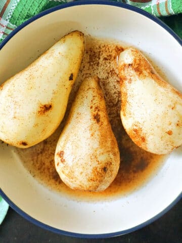 3 peeled pears in a bowl.