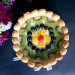 Overhead shot of a Charlotte Cake topped with fruit