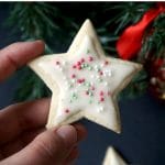 Christmas Iced Sugar Cookies, a star-shaped sweet treat for kids and grown-ups alike. Great as homemade edible gifts for families and friends this festive season, these cookies are so easy to make, and the icing only requires 2 ingredients. You can decorate them with any sprinkles you like, or even use food colouring for your icing to get different colours. Any cookie shapes can be used, and you get the best homemade Christmas cookies. #sugarcookies, #christmascookies, #icedcookies, #christmas