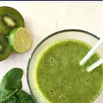 Overhead shoot of a glass of kiwi spinach smoothie