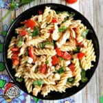 Overhead shoot of a black plate of pasta salad