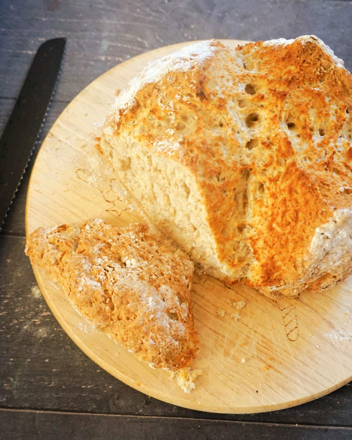 A sliced soda bread on a wooden board.