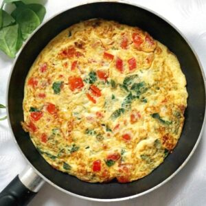 Overhead shoot of a pan with vegetarian omelette