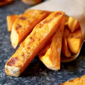 A paper cone with sweet potato fries