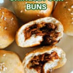 2 halves of pork buns with other buns around them.