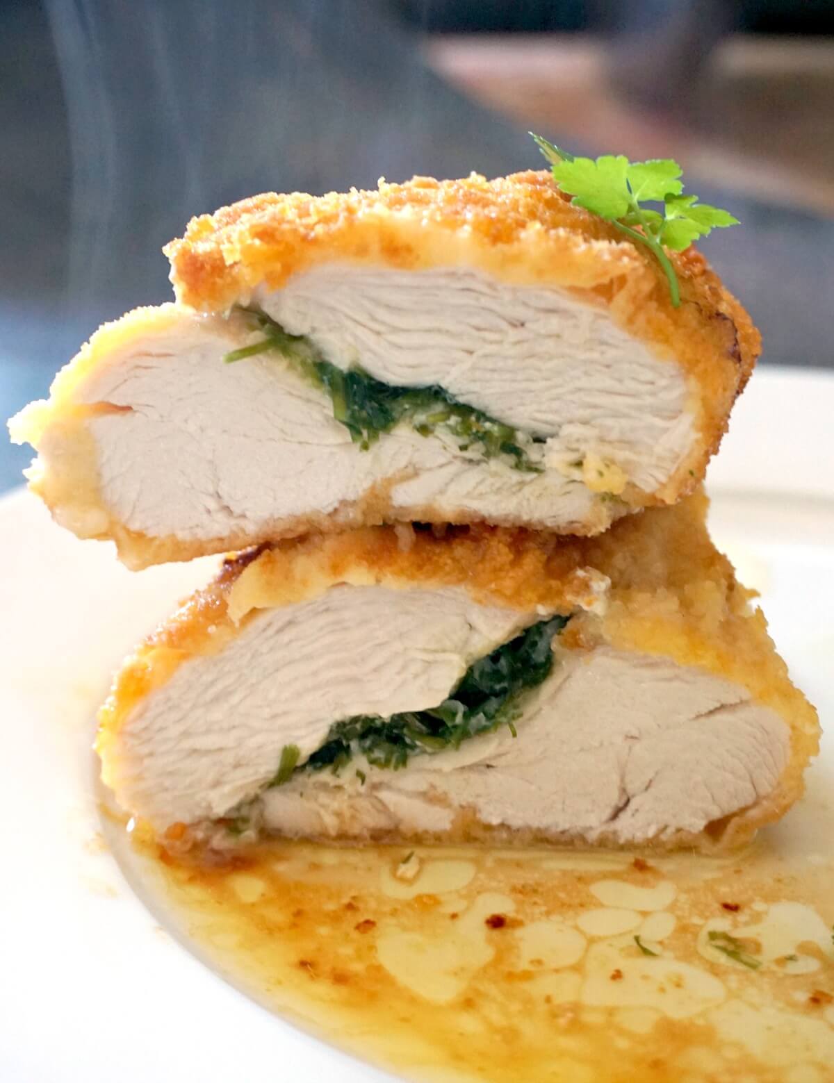 2 halves of chicken chicken kiev stacked on top of each other.