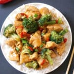 Overhead shoot of a white plate with chicken and broccoli