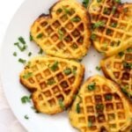 Overhead shoot of a white plate with 5 savoury cornbread waffles