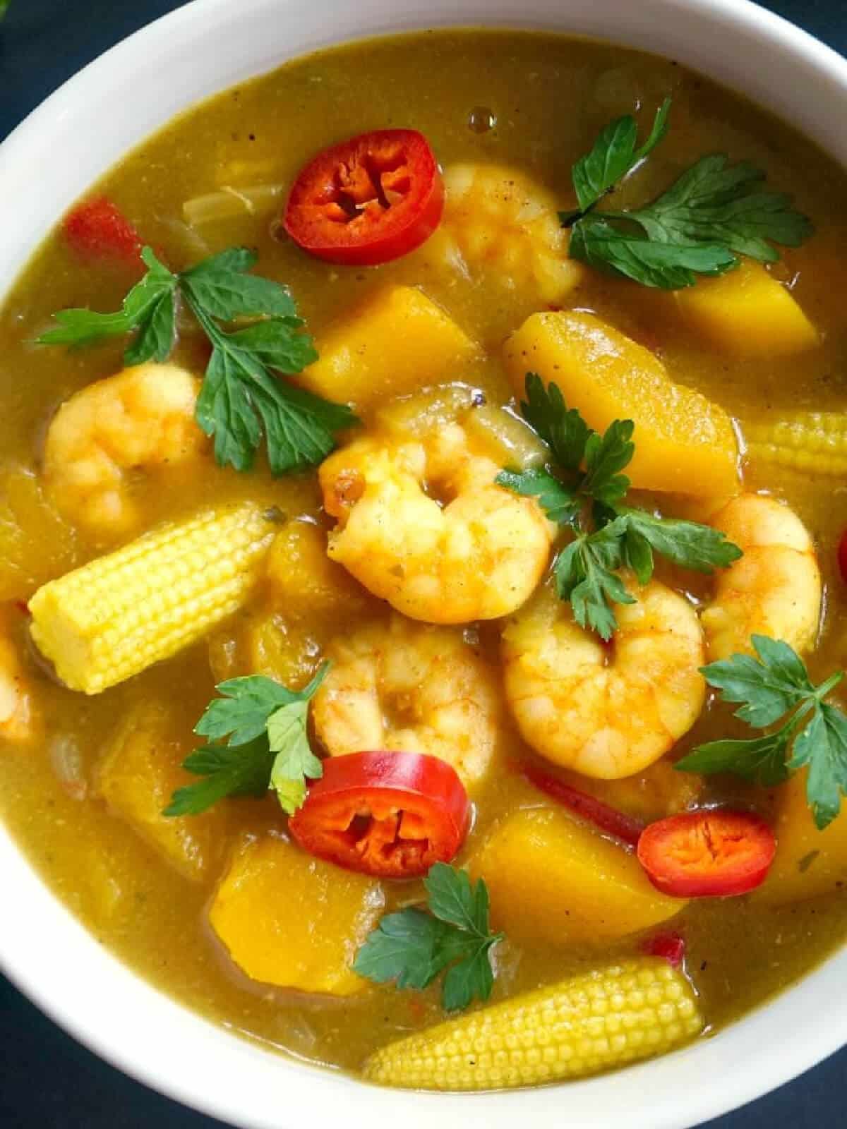 A white bowl with prawn curry.