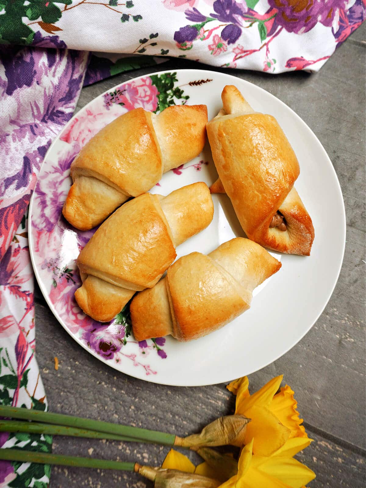 Overhead shoot of a plate with 4 crescent rolls