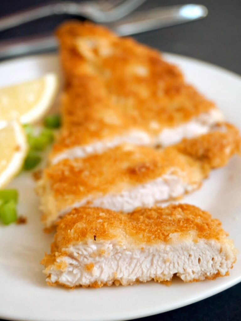 A breaded chicken fillet cut into slices