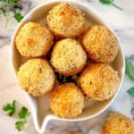 Overhead shoot of a white bowl with 7 mashed potato balls
