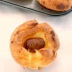A mini toad in the hole on a white table top