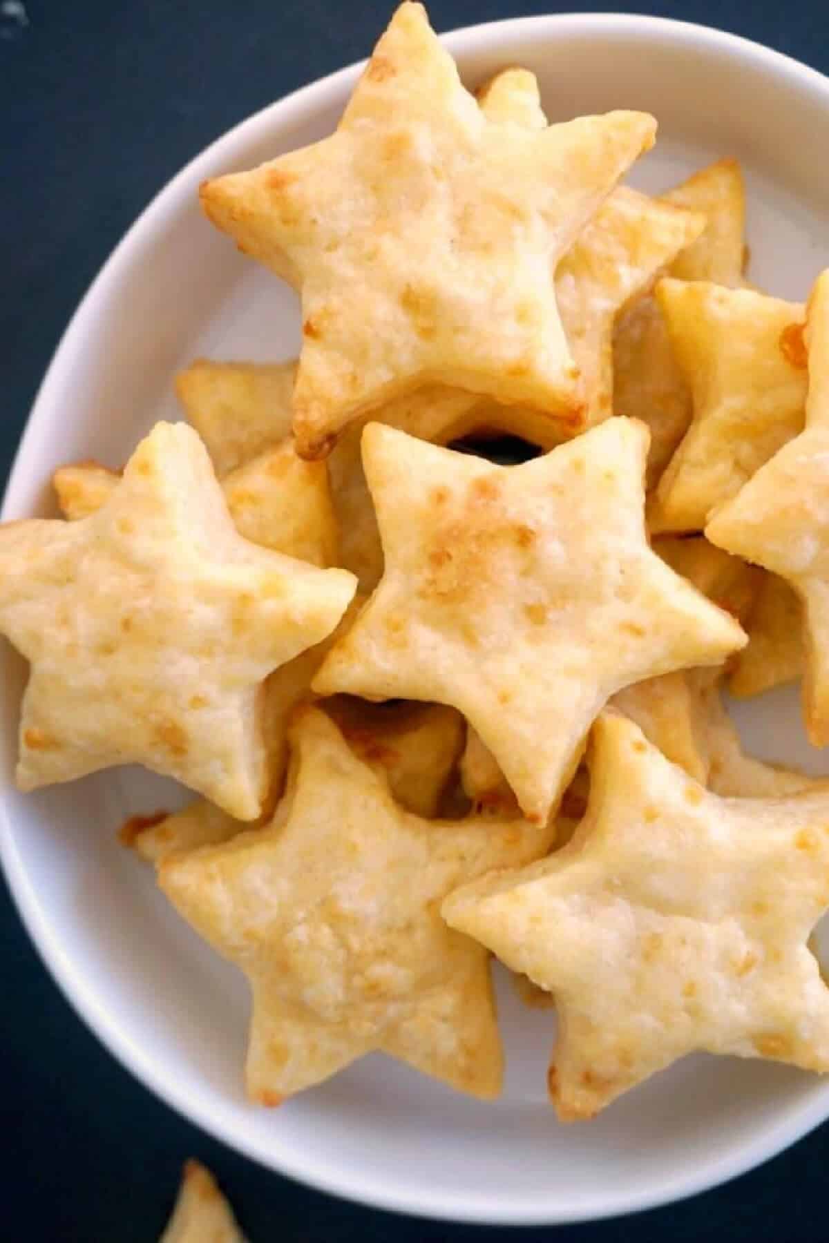 A white bowl with star-shaped crackers.