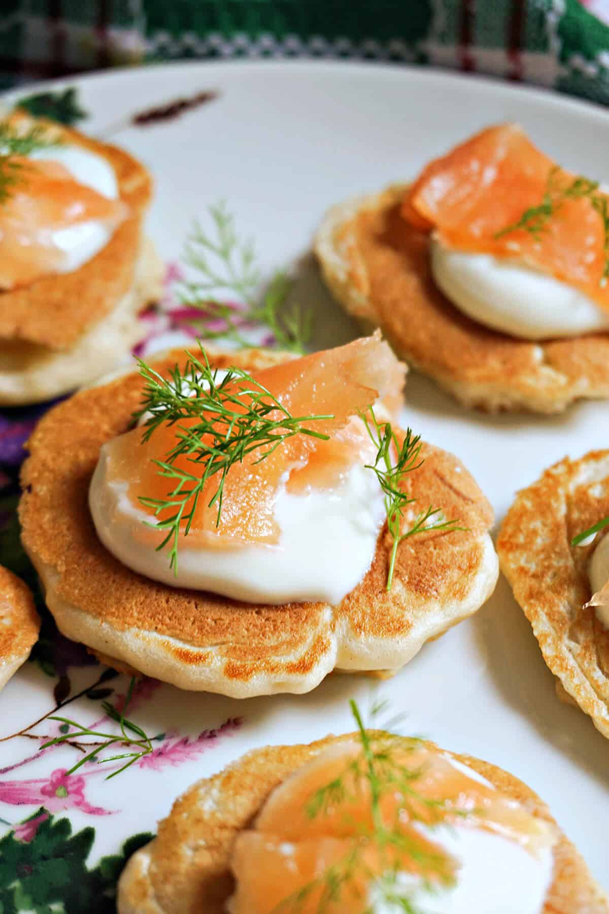 Close-up shoot of a smoked salmon topped blini.