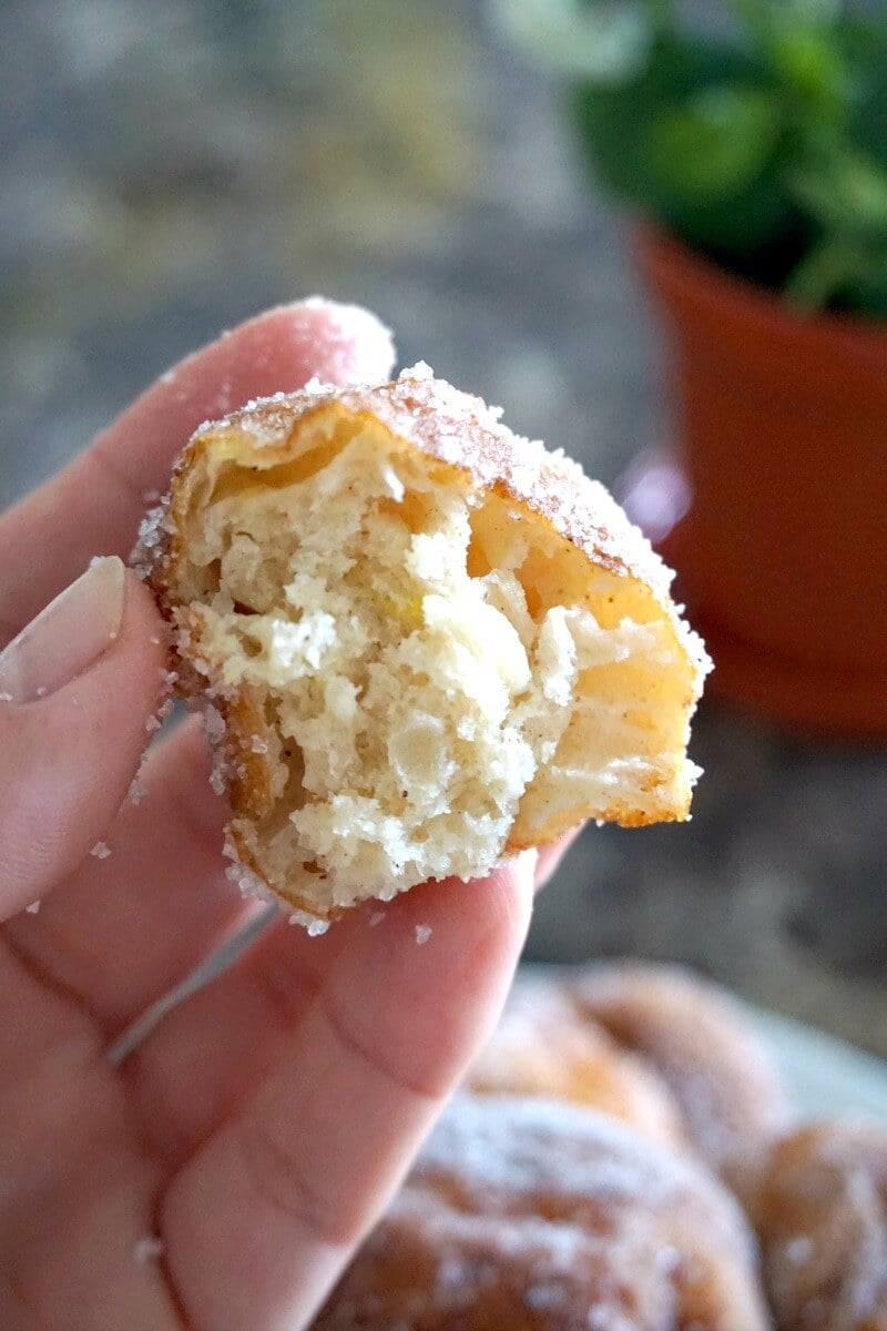 Half of a beignet to show how fluffy is inside.