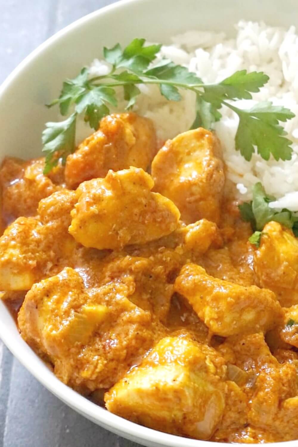 Indian Chicken Curry with Coconut Milk, a quick and easy recipe that is ready in about 30 minutes. Boneless chicken breast simmed in a rich and flavourful tomato and coconut sauce, with mild spices that give it an earthy touch, this chicken curry is a perfect midweek dinner recipe for the whole family. Nothing beats a homemade curry, and my recipe is simple anf failproof, that anyone can cook it to perfection. #chickencurry, #coconutmilk, #indiancurry, #comfortfood, #dinnerrecipe, #30minutemeals