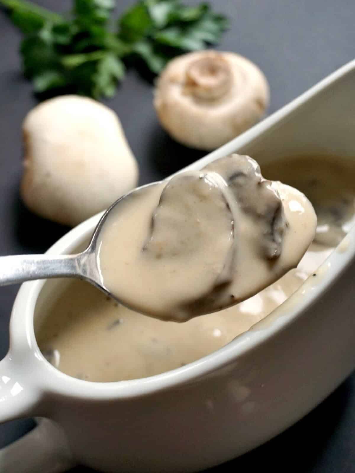 A white jug with mushroom sauce.