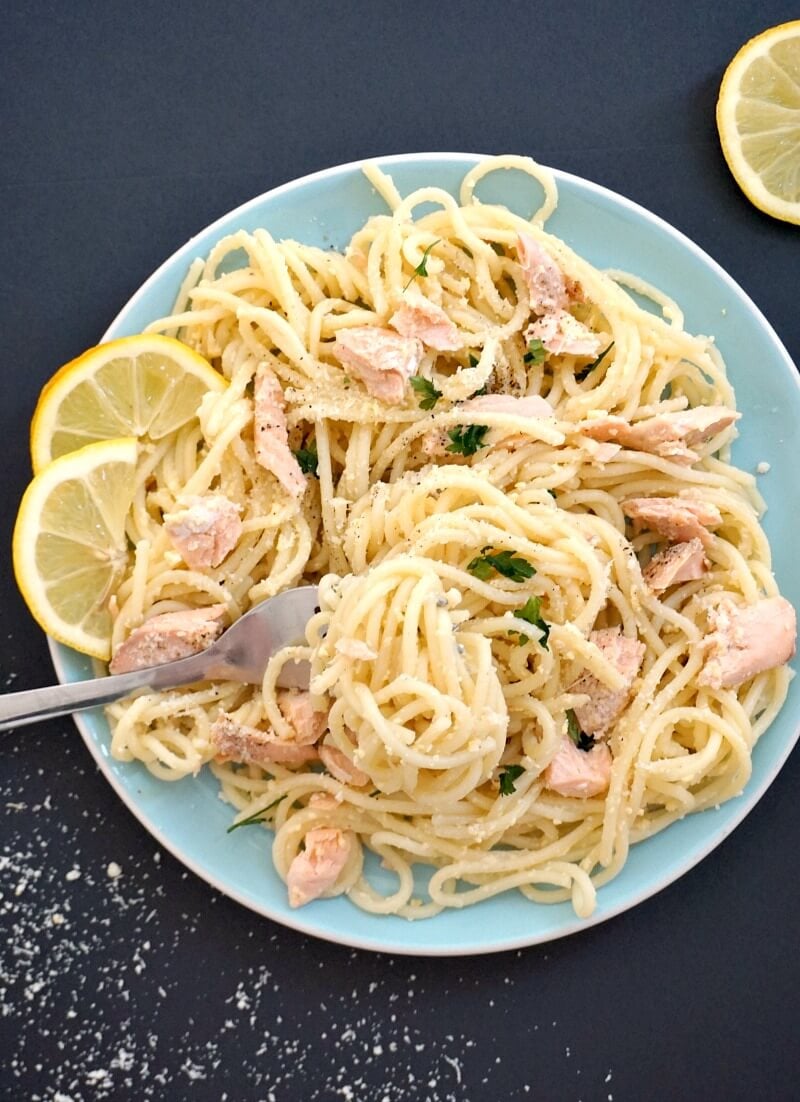 Overhead shoot of a light blue plate with salmon pasta