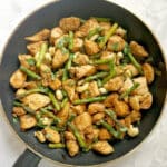Overhead shoot of a pan with chicken and asparagus stir fry