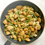 Overhead shoot of a pan with chicken and asparagus stir fry