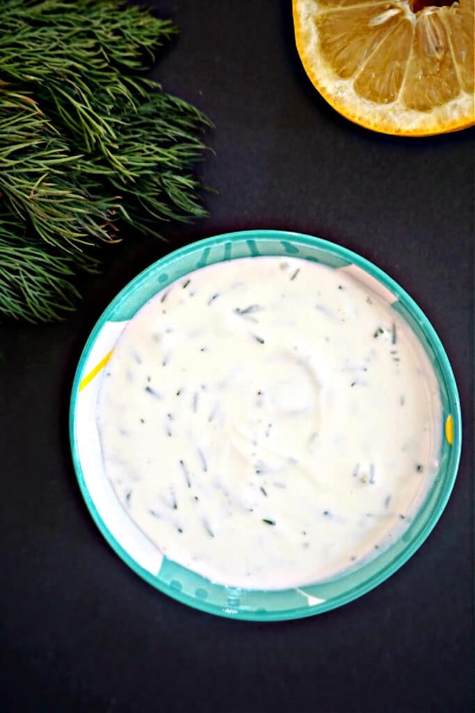Overhead shoot of a light blue ramekin with yogurt sauce