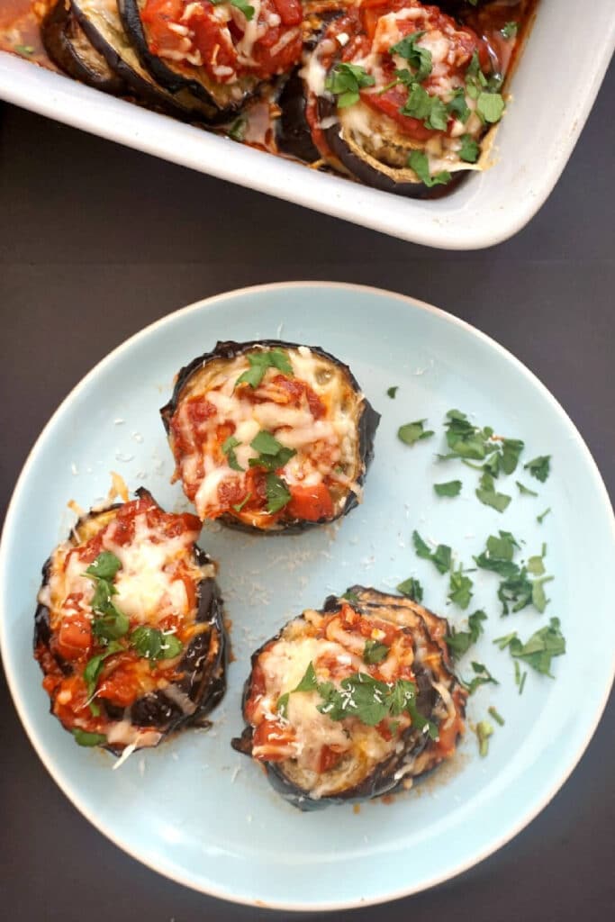 Overhead shoot of a light blue plate with 3 aubergine stacks