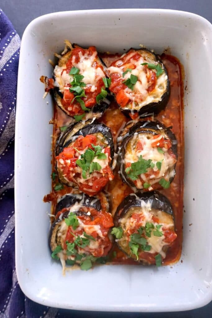 Overhead shoot of a dish with 6 stacks of aubergine slices