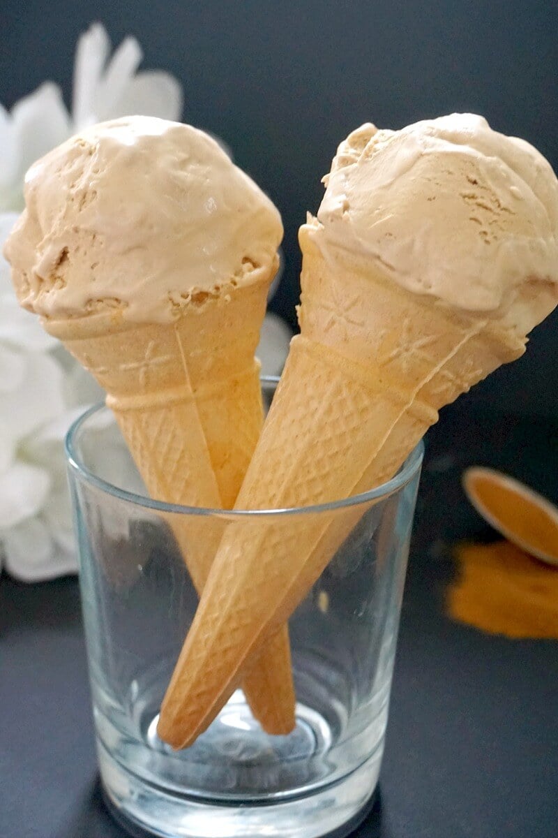 A glass with 2 cones of coffee ice cream