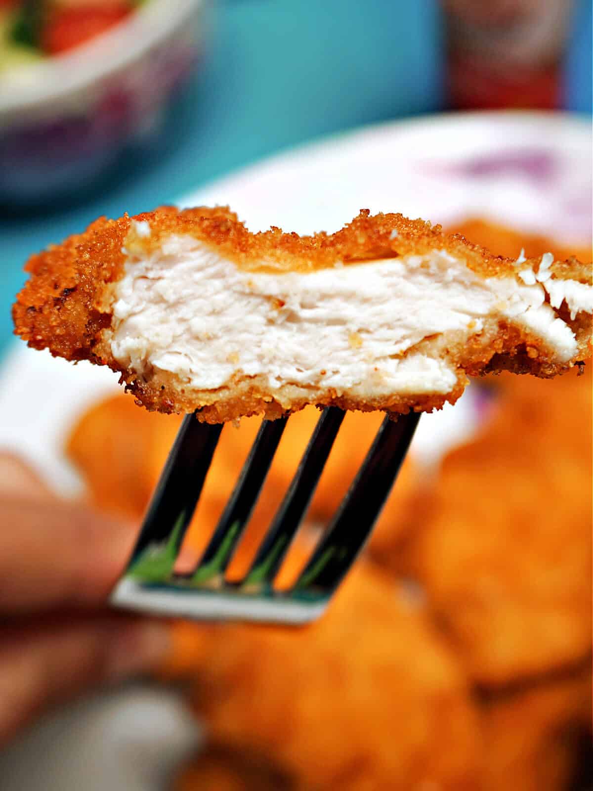 Half a chicken tender to show how it looks inside.