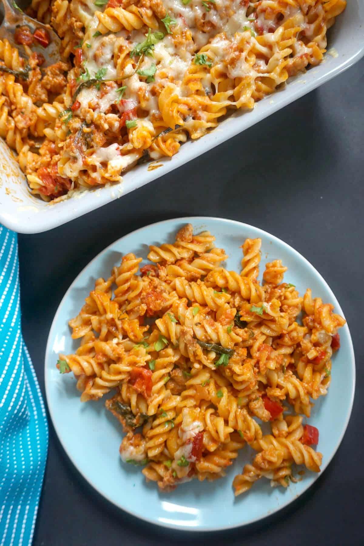 A light blue plate with a portion of pasta.