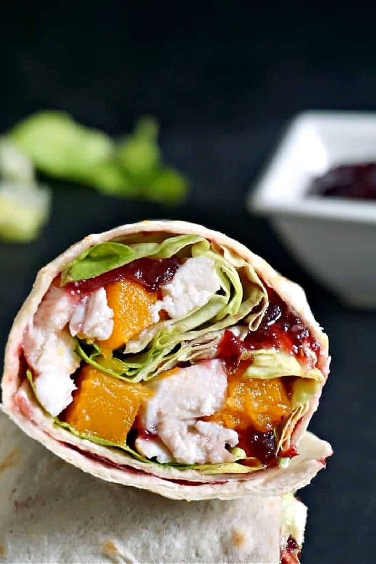 Close-up shoot of half of a turkey wrap.