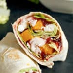 Half of a turkey wrap over another half wrap
