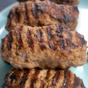 A pile of mici on a plate