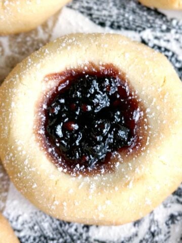 A thumbprint cookie filled with jam