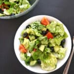 Overhead shoot of a white bowl with green salad