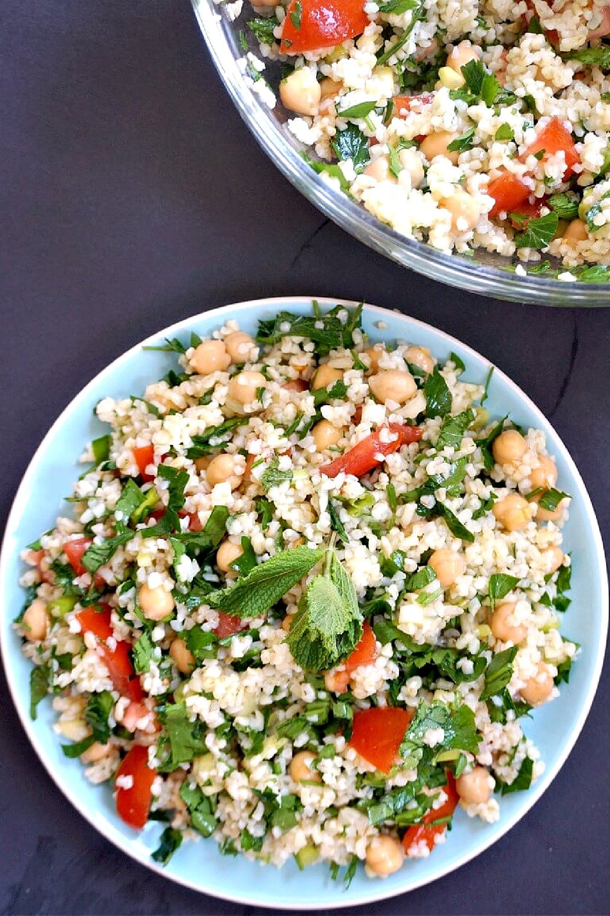 Overhead shoot of a light blue plate with tabbouleh.