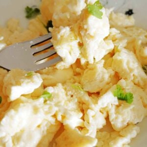 Close-up shot of a plate with scrambled eggs