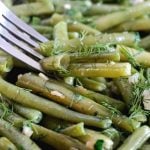 Quick and Easy Sautéed Green Beans with Garlic and butter, a delicious side dish for Thanksgiving or Christmas. This simple recipe can be made with either fresh or frozen green beans. It is vegetarian friendly, but it can be made vegan by swapping butter for vegetable oil. Healthy, nutritious and delicious, a fanatastic side for every occasion.