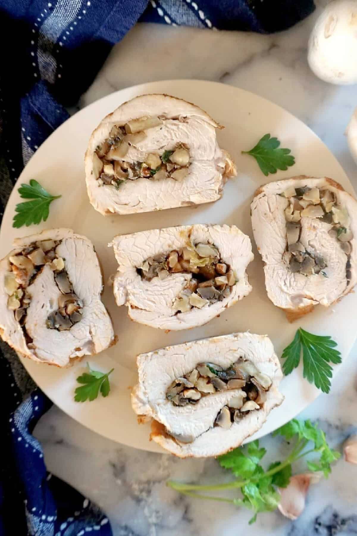 Overhead shoot of a plate with 5 turkey rolls.