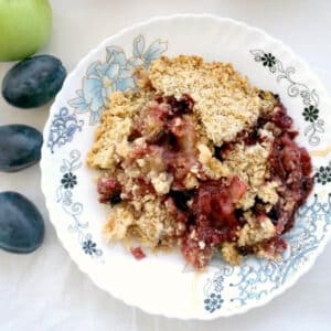 Overhead shoot of a plate with plum crumble