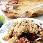 Apple and Plum Crumble, a delicious Fall dessert made with fresh seasonal fruit. This indulgent sweet treat has a hint of cinnamon and lemon, and goes very well with a scoop of ice cream or some custard. Super easy to make, and so indulgent.