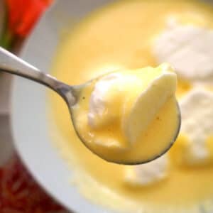 A white plate with custard and egg white islands