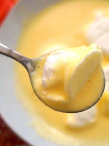 A white plate with custard and egg white islands